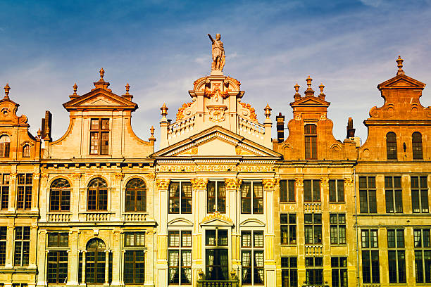 Brussels Skyline Brussels skyline showing richly ornate rooftops of the guildhalls at Grand Place. houses in brussels stock pictures, royalty-free photos & images