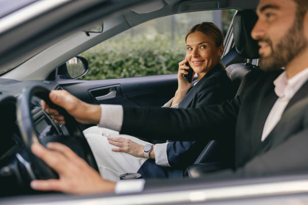 istock Two positive business colleagues in suit carpooling journey into work together 1706459868