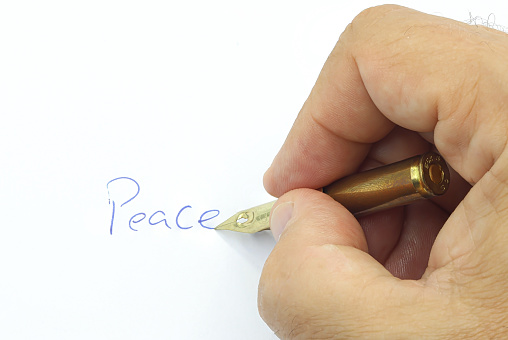 Writing the word peace with a bullet