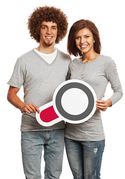 istock Smiling young couple holding search sign isolated on white background. 170647217