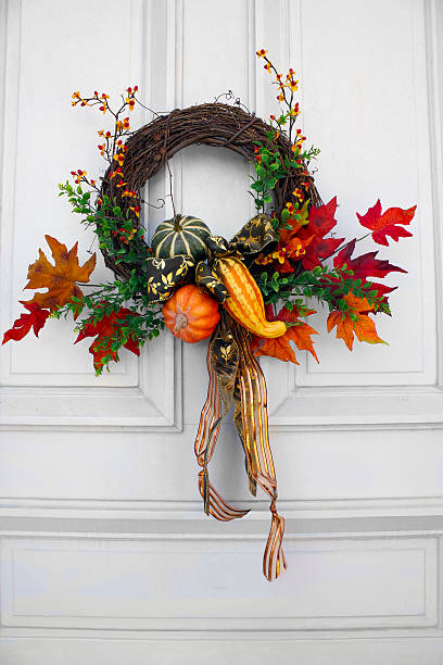 Autumn wreath on a white door. 