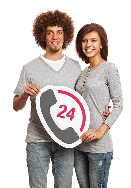istock Smiling young couple holding client support sign isolated on white. 170647230