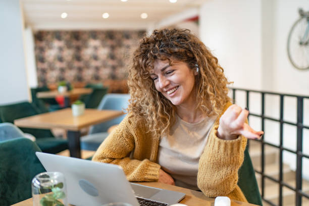 istock Beautiful young woman having video call 1706472552