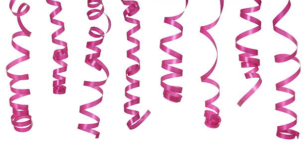 Curled pink ribbons on a white background Pink ribbons isolated on white background streamer stock pictures, royalty-free photos & images