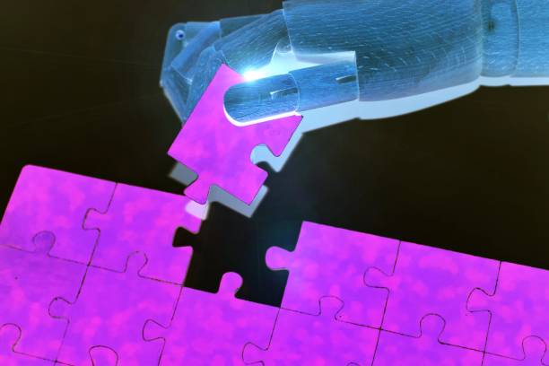 istock Close-up Of Robot Hand Holding a Jigsaw Puzzle Digital transformation, AI, artificial intelligence technology, machine learning. 1706489739
