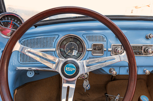 1966 Volkswagen Beetle, Santos, Brazil. April 20, 2018: Car interior. Dashboard, speedometer, steering wheel, radio.
