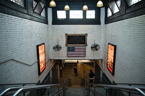 Boston, USA - February 12, 2012: Interior of a subway entrance in Boston with American flag.