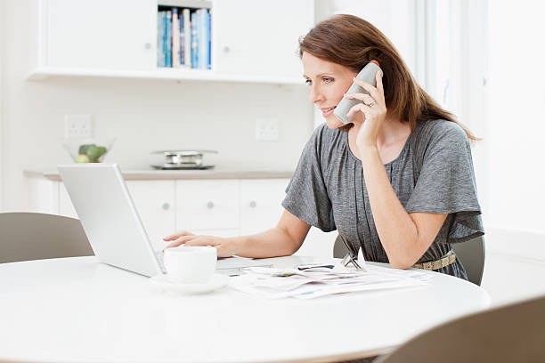 Woman talking on telephone  cordless phone stock pictures, royalty-free photos & images