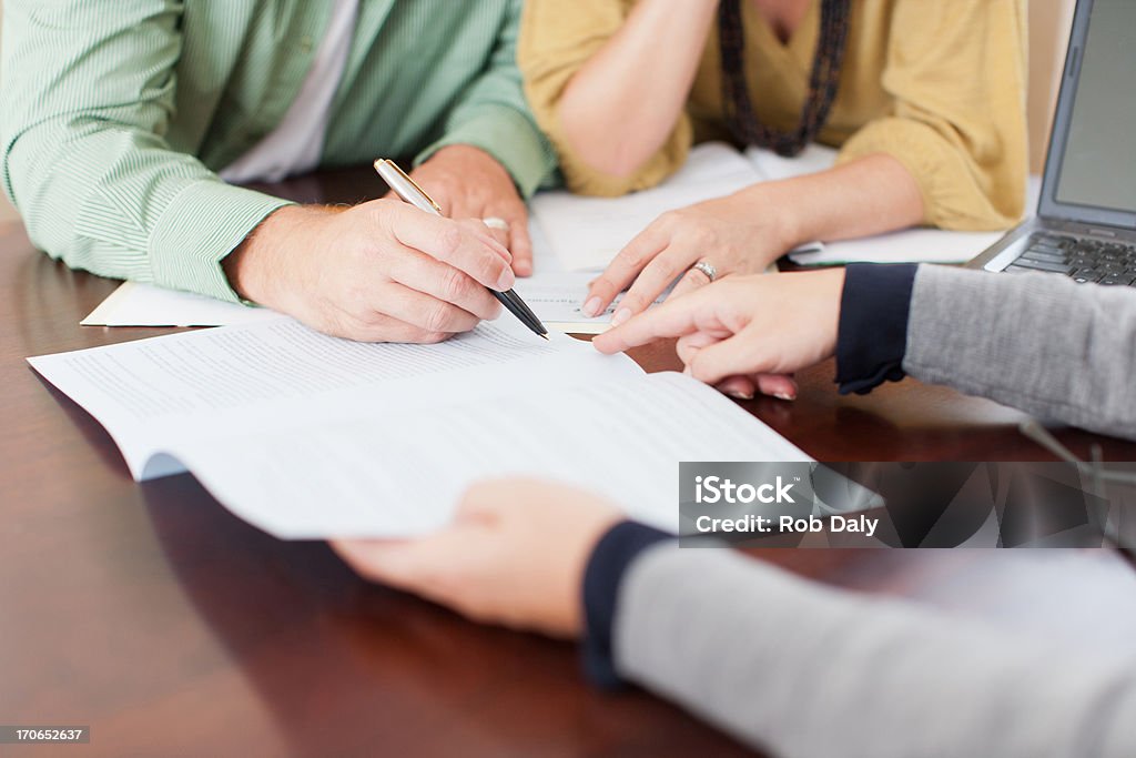 Couple signing contract  Contract Stock Photo