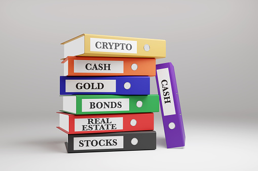 Colorful ring binders labelled with different products of investment on white background. Illustration of the concept of financial portfolio diversification of investment