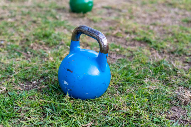 istock Kettlebell on the lawn for outdoor strength exercise. 1706577804