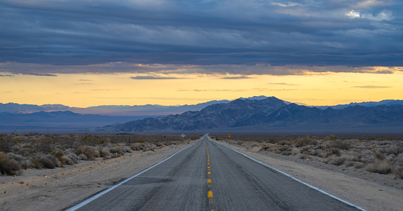 Desert Highway stretches to the horizon in the Mojave Desert.