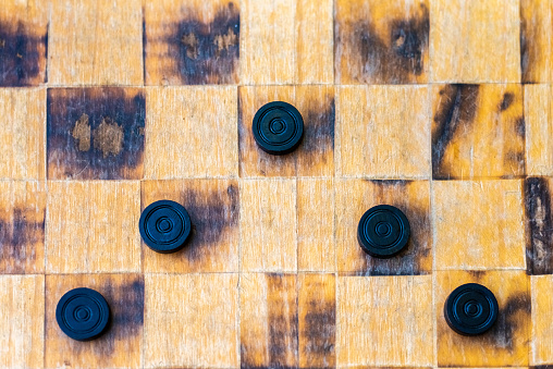 Checker game pieces, concepts of struggle, strategy and confrontation.