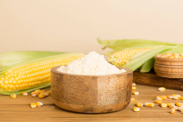 istock Corn flour with fresh cobs on wooden table 1706594993