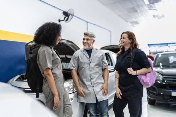 istock Auto mechanics talking on a repair shop 1706597169