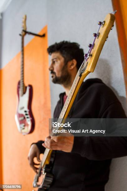 Side View Of Young Man Playing Guitar Stock Photo - Download Image Now - Adult, Adults Only, Arts Culture and Entertainment