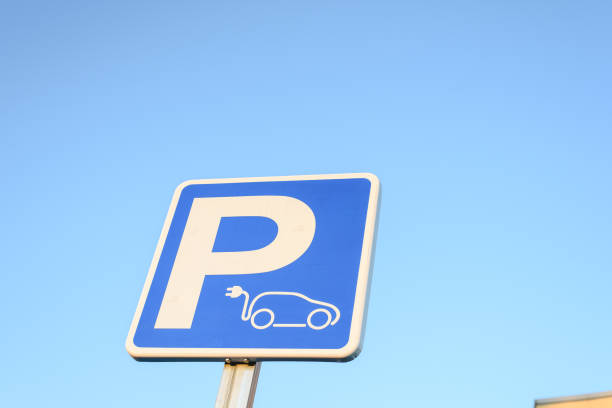 istock Concept of ecological mobility and zero emissions. Vertical signal parking for recharging electric cars. 1706637301