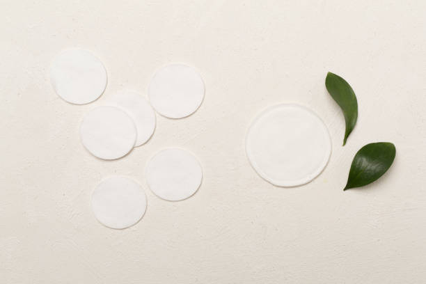 istock Reusable cotton pads with disposable ones on concrete background, top view 1706639995