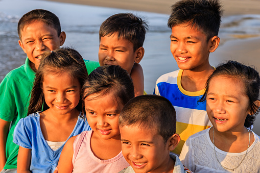 Group of happy Vietnamese children on the beach, Vietnam