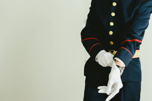 istock Military man hands putting on some elegant white gloves. 1706653716
