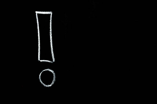 istock Exclamation mark, drawn by hand on a black chalkboard 1706654456