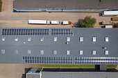 aerial view of truck trailers parked next to the warehouse