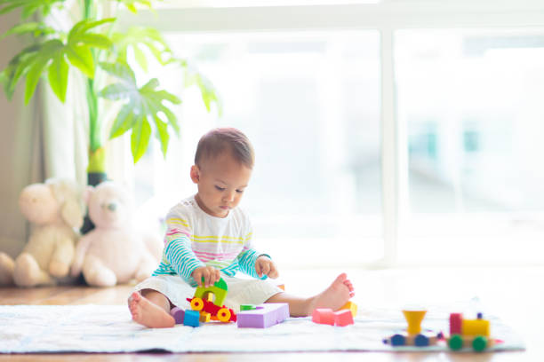 istock Baby boy playing with toy 1706659598