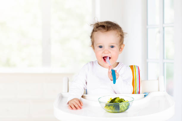 istock Baby eating vegetables. Solid food for infant. 1706663928