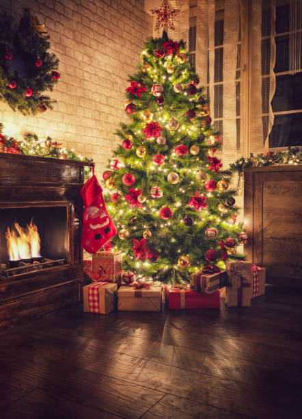 istock Decorated Christmas tree near fireplace at home 1706671721