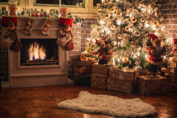 istock Decorated Christmas tree near fireplace at home 1706671738