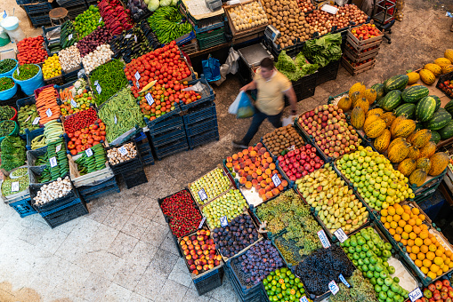 Top view of vegetable and fruit sales stalls. 
The greengrocer was photographed using the long exposure technique.. Shot with a full frame camera.