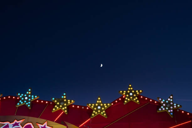 Flat background of blue sky with small moon and luminous light bulbs.