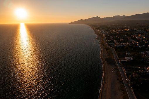 Drone view of sunset over coastline in Epirus, Greece