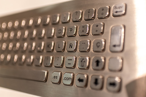 Metallic keyboard with letters and numbers to enter information in a cashier.