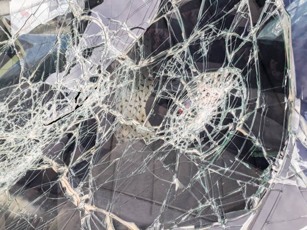 istock Car windshield shattered with stones by vandals. 1706729460