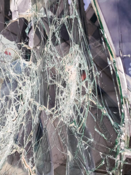 istock Car windshield shattered with stones by vandals. 1706737175