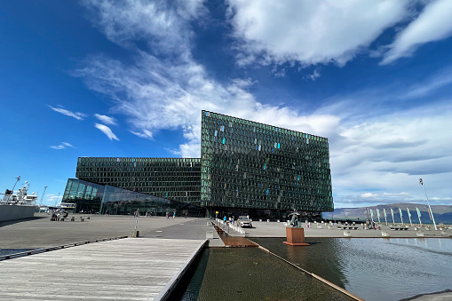 July 12, 2023- Reykjavik, Iceland.  Visitors to the city explore the area around the Harpa concert hall and the old city harbor.