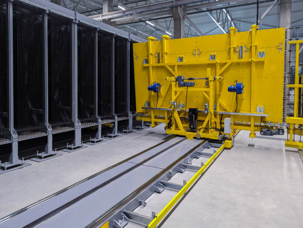 istock Automatic glass shuffler sorting glass sheets in modern glass factory. 1706755054