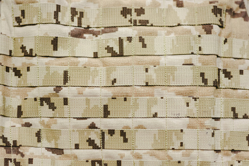 Detail of a military camouflage bulletproof vest.