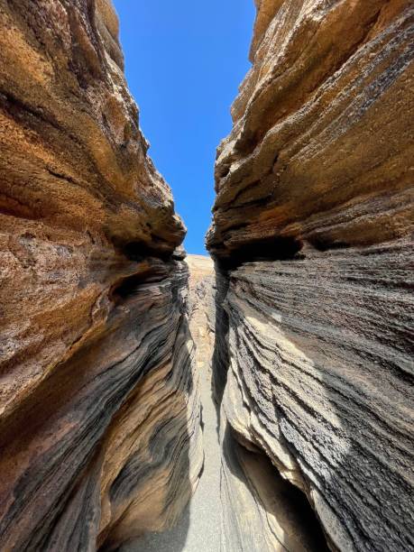 istock Distinct rock formations situated close each other: Las Grietas, Lanzarote, Canary Islands 1706761575