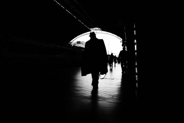 istock Silhouette of passengers in a train station. 1706767185
