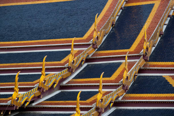 Ornate roof of the Phra Ubosot, or ordination hall, - part of the temple complex.at the Wat Phra Kaew (Temple of the Emerald Buddha), Bangkok Thailand which occupies almost the entire southern part of the complex