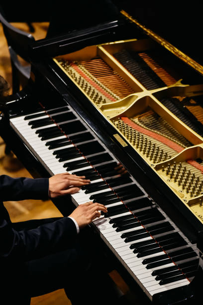 istock Hands of classical pianist playing his piano during a concert. 1706799375