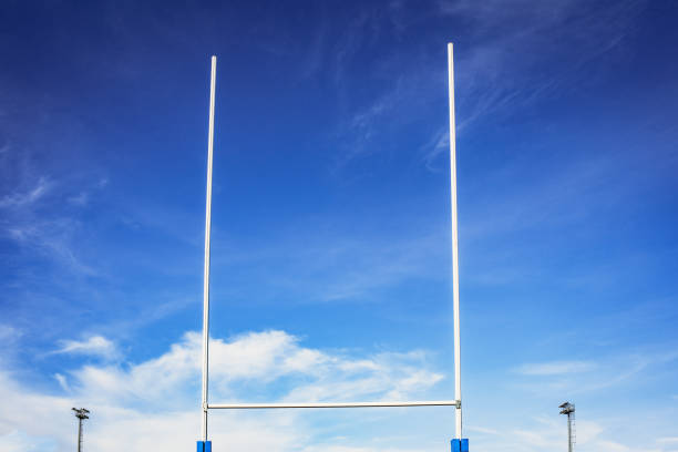 istock Background of a rugby goal casting shadows on the field. 1706816094