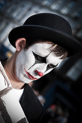 Edinburgh, Scotland - August 14, 2010: Actor makeup and disguised as depressed sad clown