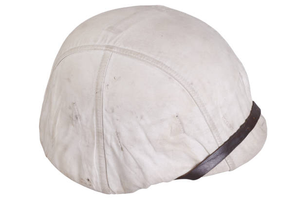 istock Army helmet with white winter camouflage cover 1706905625