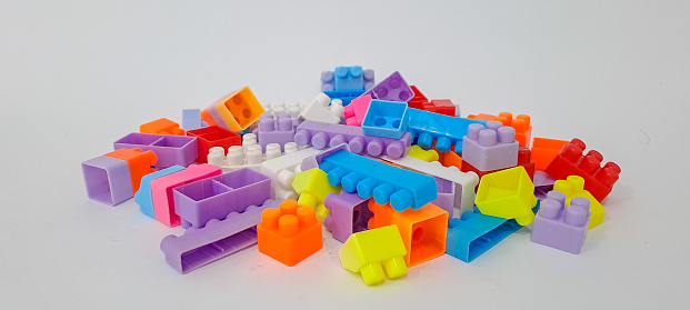 Educational toys for kids mockup. Colorful plastic blocks on white background.