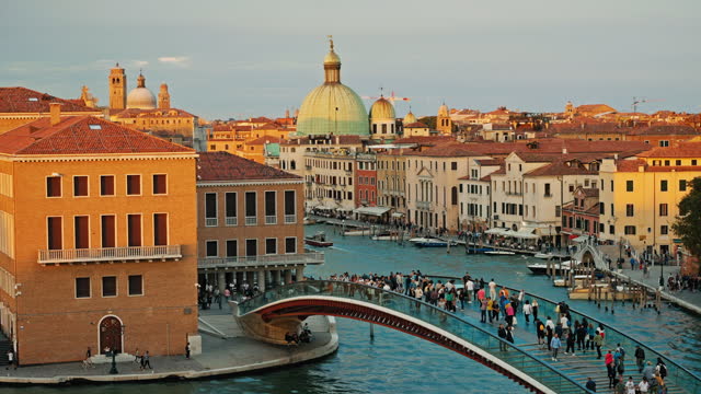 SLO MO Tourists Walking on Constitution Bridge over Grand Canal near Buildings in Venice
