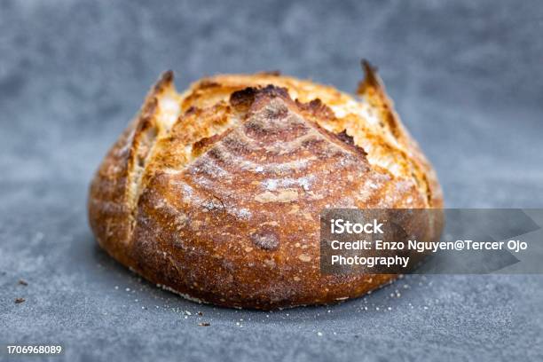 Artisan Loaf Of Traditional Homemade Sourdough Boule Bread With Crust Stock Photo - Download Image Now