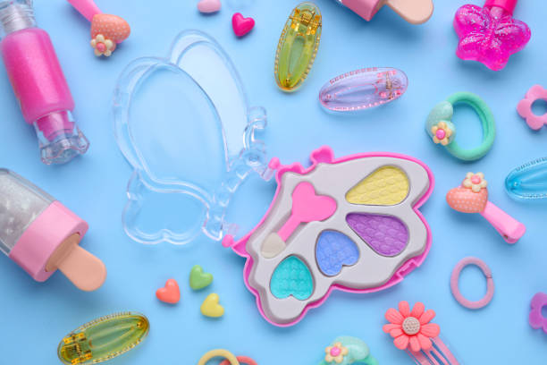 istock Eye shadow palette and other decorative cosmetics for kids on light blue background, flat lay 1707028743